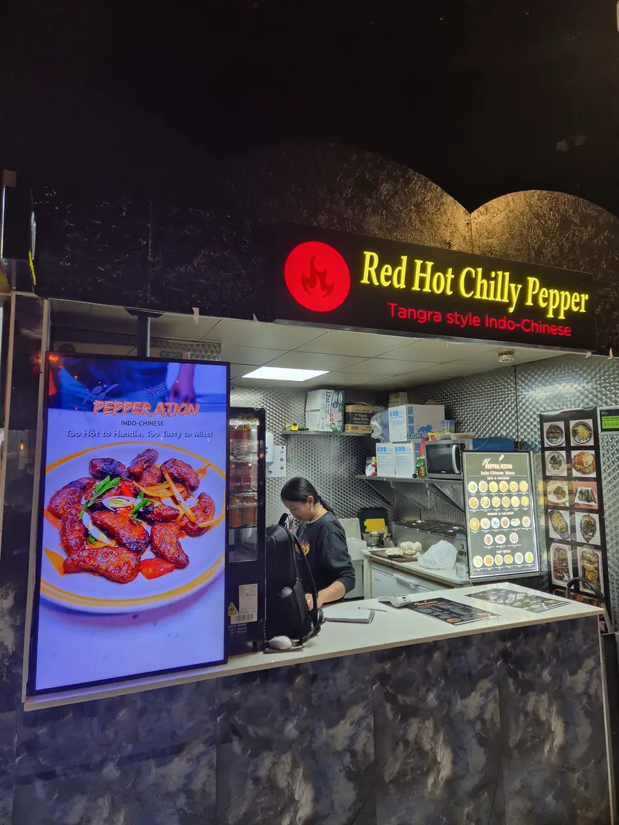Digital display showing fried chicken combos and promotions.