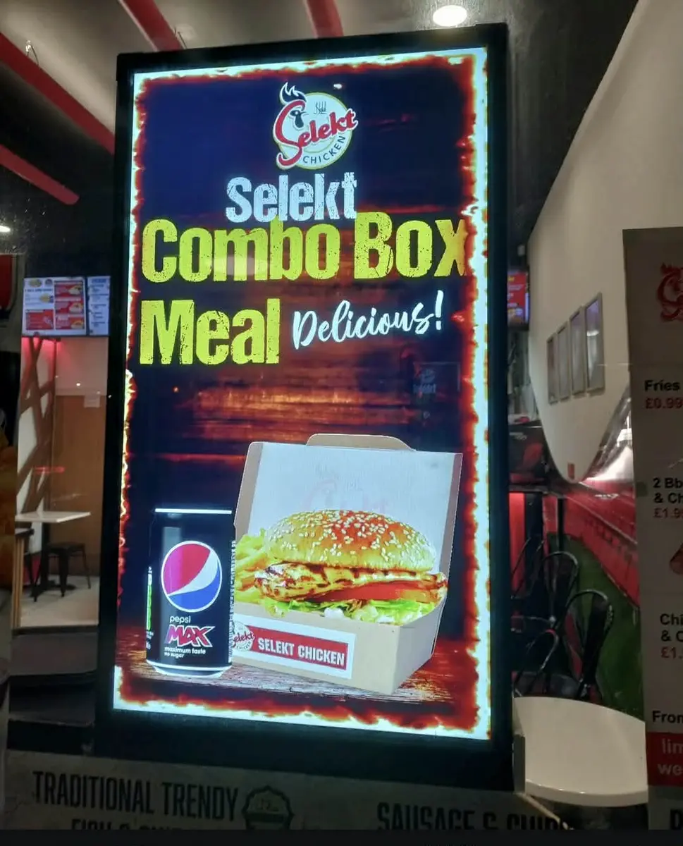 Takeaway digital screen featuring pizza deals and special offers.