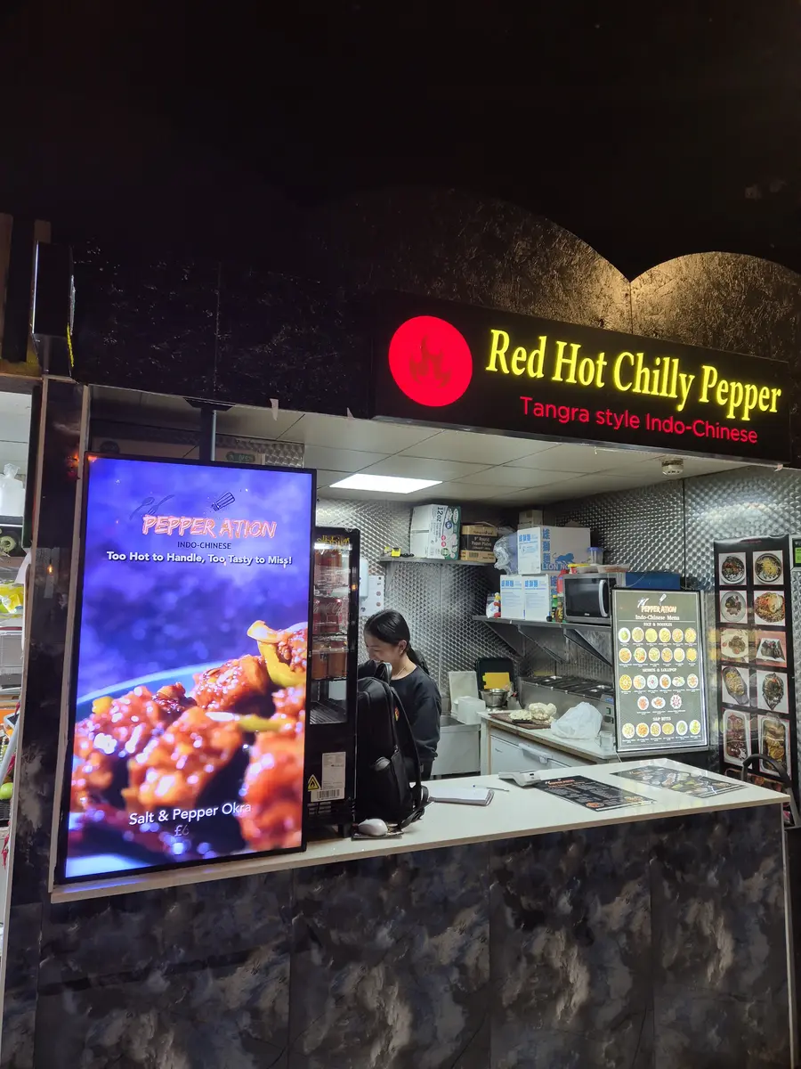 Eye-catching digital signage in a chicken shop window.